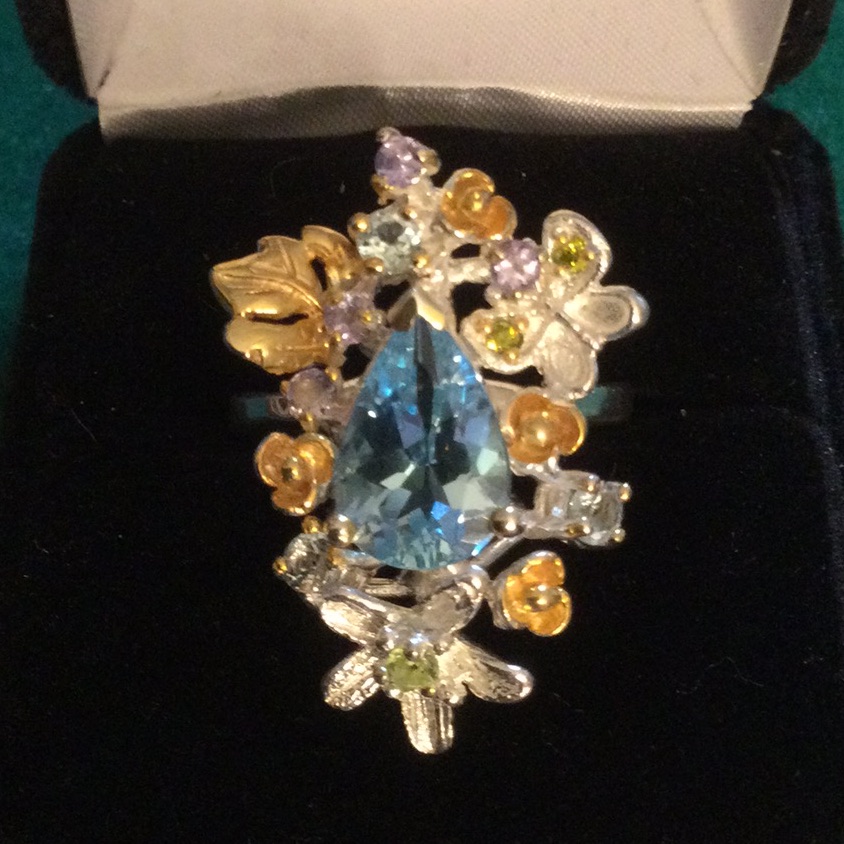 Genuine Blue Topaz Ring Encrusted Withtanzanite, Aquamarines & Peridot.